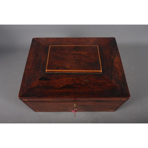 254 - A rosewood sarcophagus sewing box and a quantity of sewing accessories, including needles, coloured ... 