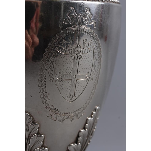 322 - An 18th century silver pedestal hot water jug with acorn finial, acanthus and laurel leaf decoration... 