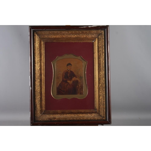 358 - A pair of 19th century coloured  photographs of a man and a woman, in deep gilt and wooden frames, a... 