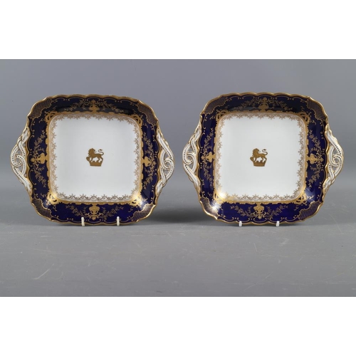 4 - A pair of Coalport porcelain dishes with gilt armorial decoration, 9 1/2