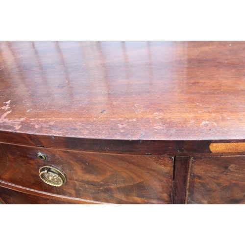 408 - A Victorian figured mahogany bowfront chest of two short and two long drawers with brass ring handle... 