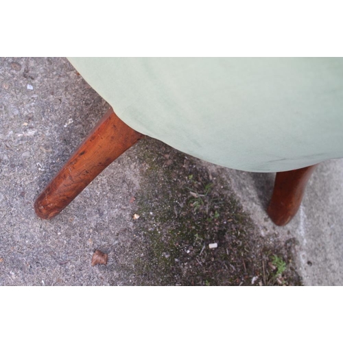 428 - A Victorian mahogany open armchair, button upholstered in a green velour, on turned and carved suppo... 