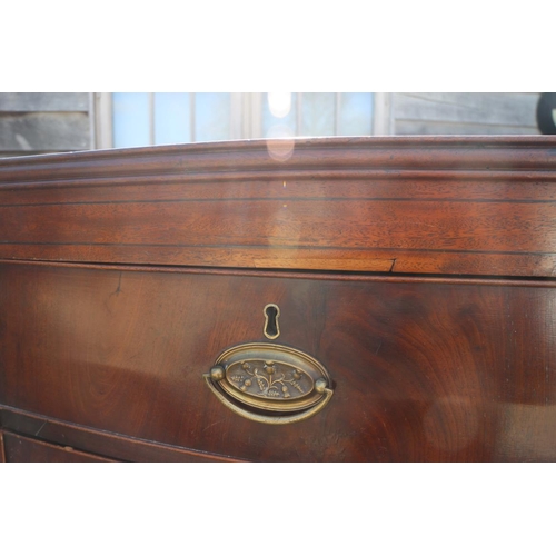 436 - An early 19th century figured mahogany bowfront chest of two short and five graduated long drawers w... 