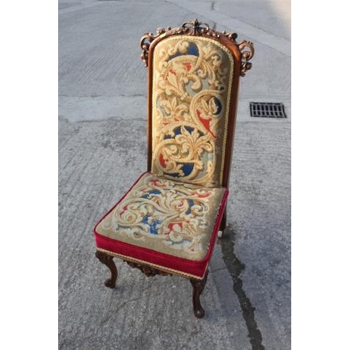 451 - A late Victorian carved rosewood showframe prie dieu/nursing chair with Pugin style needlepoint seat... 