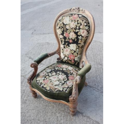 452 - A 19th century carved and faded mahogany showframe open armchair with needlepoint seat and back pane... 