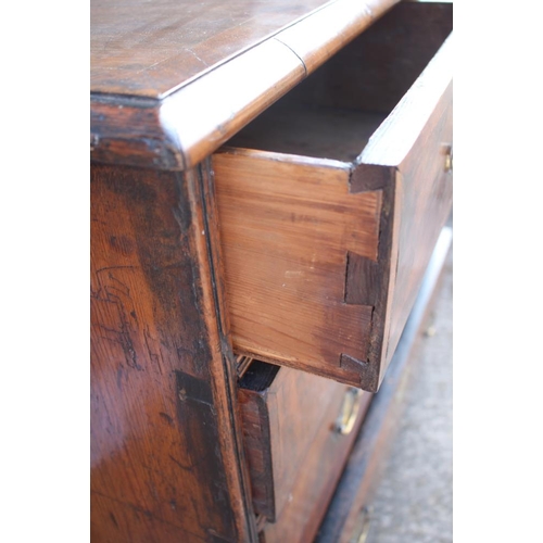 471 - A mid Georgian walnut and banded chest of two short and three long graduated drawers with original b... 