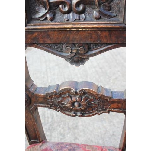 472 - A 19th century Renaissance revival carved walnut side chair with panel back monogrammed 