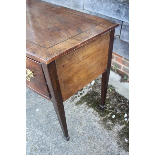 475 - An early 19th century mahogany, banded and ebony line inlaid bowfront sideboard, fitted one shallow ... 