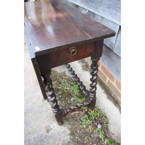 480 - An early 18th century walnut single drop leaf side table, on barley twist turned and stretchered sup... 