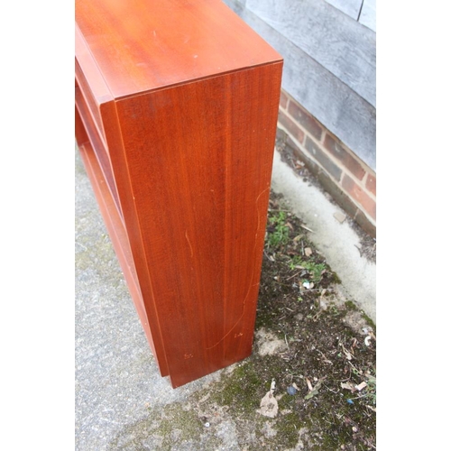 521 - A Gordon Russell mahogany low open bookcase, fitted two adjustable shelves, on block base, 37