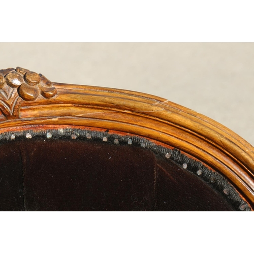 537 - A pair of carved and polished as walnut showframe low-seat nursing chairs, button upholstered in a c... 