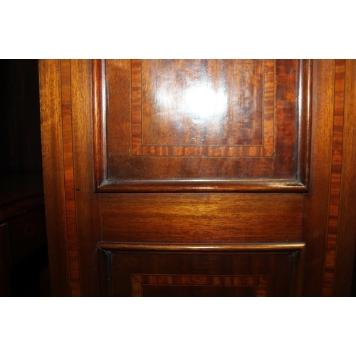 554 - An Edwardian walnut and satinwood banded wardrobe, enclosed mirror door over one long drawer, on blo... 