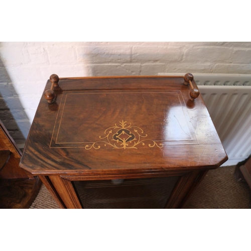 579 - An early 20th century figured walnut and inlaid music cabinet enclosed glazed panel door, on bracket... 