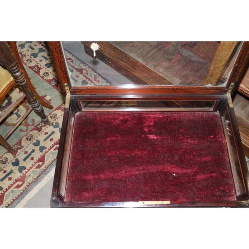 592 - An Edwardian carved mahogany display table, on slender tapering supports united by 'X' stretcher and... 