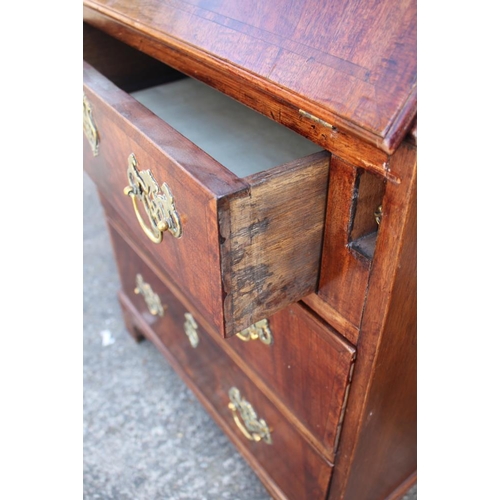 593 - A mahogany and banded fall front bureau, the fitted interior over three long drawers with pierced br... 