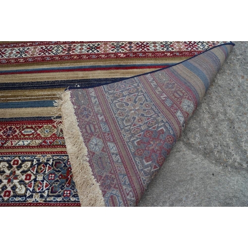 611 - A multi-coloured Kashmir carpet with all-over traditional design, 67