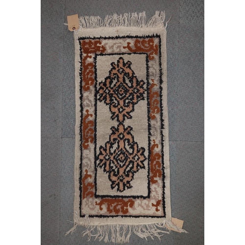 615 - A Kazak kelim rug with two hooked guls on a tan ground, 50