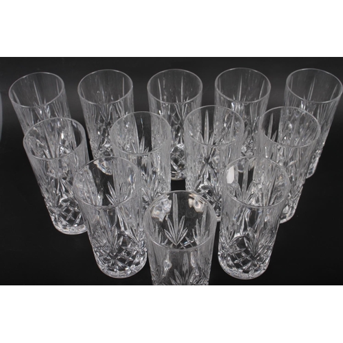 63 - A set of twelve cut glass drinking glasses, 5 3/4