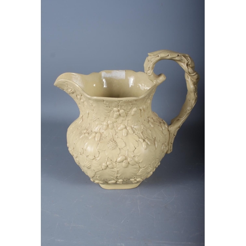 64 - A 19th century jug with relief acorn decoration, 7 1/4