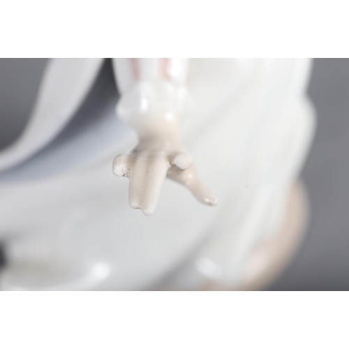 79 - A Lladro figure of a girl, 10