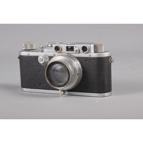 133 - A Leica Rangefinder camera, No 234416, with Summar 50mm f1:2 No 350906, in leather case (shows signs... 