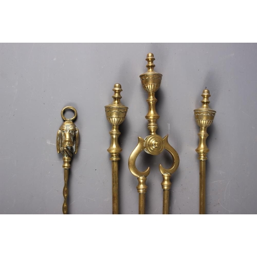 144 - A set of three late 19th century brass fire implements with vase finials and a Beacon patent toaster