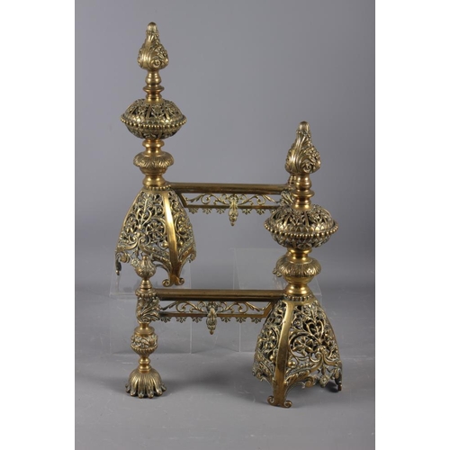 153 - A pair of late 19th century pierced brass andirons/implement rests of restoration design, 16 1/2