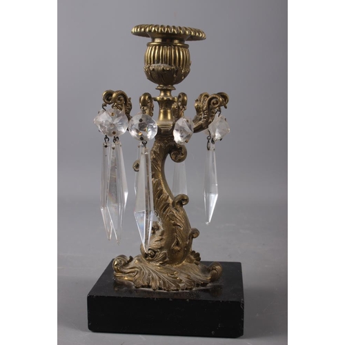 154 - A pair of early 19th century gilt bronze dolphin and cut glass table lustre candlesticks, on black s... 