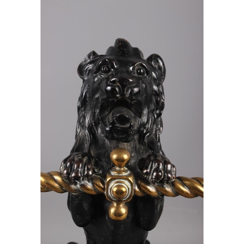 158 - A pair of mid 19th century cast iron and brass lion implement rests/fire dogs, 14