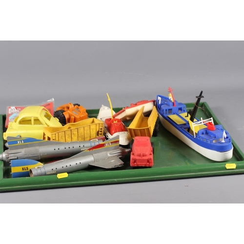 179 - A collection of 1950s and 1960s plastic toys, including space rockets, early Thunderbirds, etc