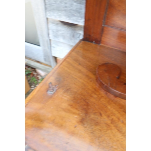 417 - A Regency mahogany chiffonier, fitted two open shelves over fabric fronted cupboards, on turned supp... 