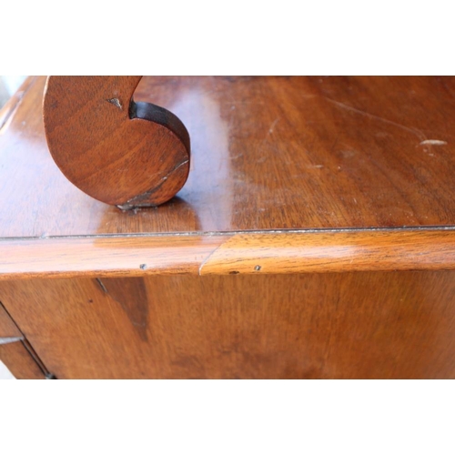 417 - A Regency mahogany chiffonier, fitted two open shelves over fabric fronted cupboards, on turned supp... 