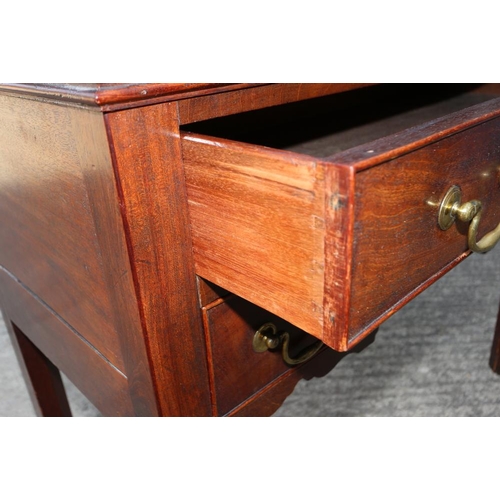 418 - An 18th century mahogany lowboy, fitted one long drawer over two short drawers and shaped apron, on ... 