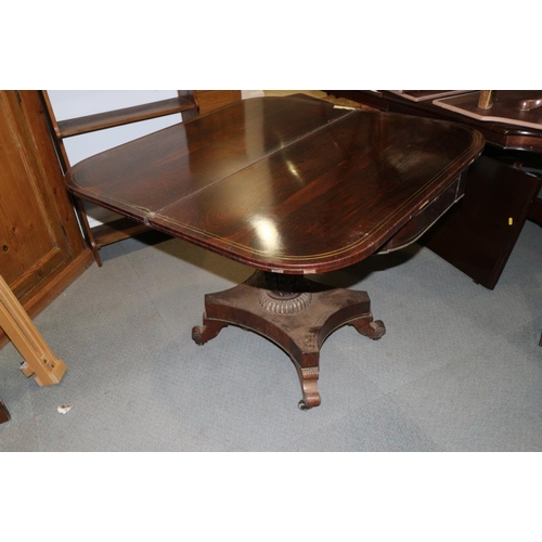 419 - A Regency rosewood and brass inlaid fold-over tea table, on turned and acanthus carved column and qu... 