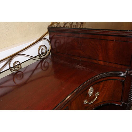 484 - A Regency mahogany and ebony line inlaid inverse break bow drop centre sideboard with brass scroll r... 