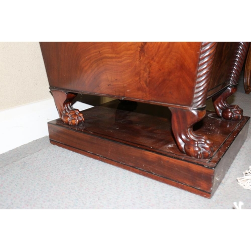 484 - A Regency mahogany and ebony line inlaid inverse break bow drop centre sideboard with brass scroll r... 