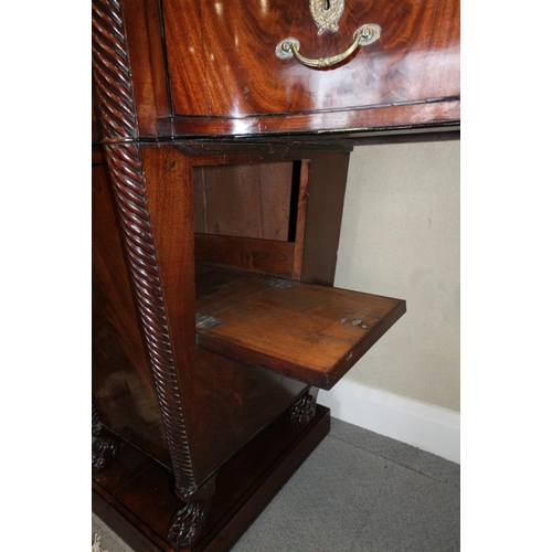 484 - A Regency mahogany and ebony line inlaid inverse break bow drop centre sideboard with brass scroll r... 