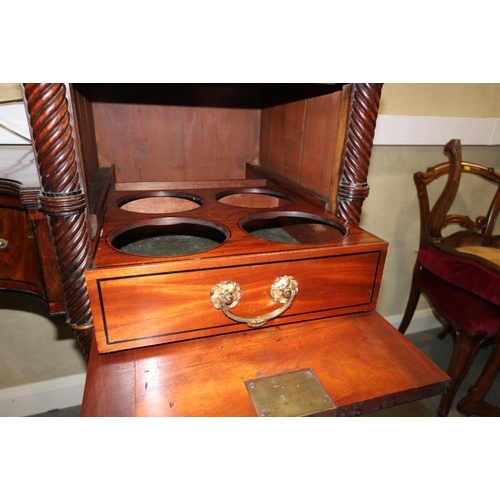 484 - A Regency mahogany and ebony line inlaid inverse break bow drop centre sideboard with brass scroll r... 