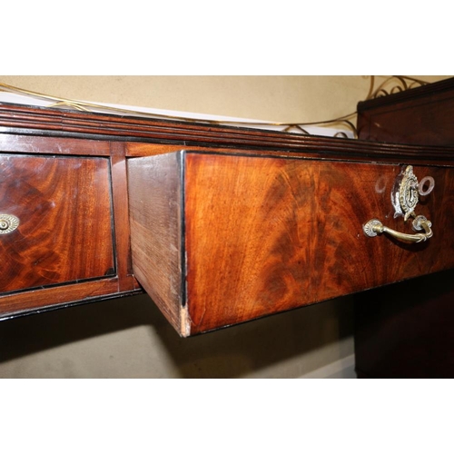 484 - A Regency mahogany and ebony line inlaid inverse break bow drop centre sideboard with brass scroll r... 