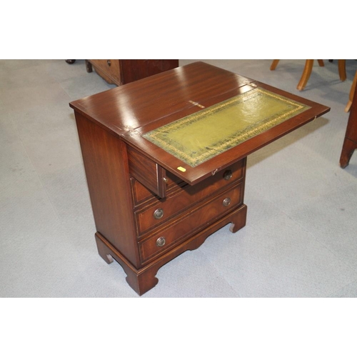 530 - A bachelor's polished as mahogany chest with leather inset fold-over top, over four long drawers, on... 