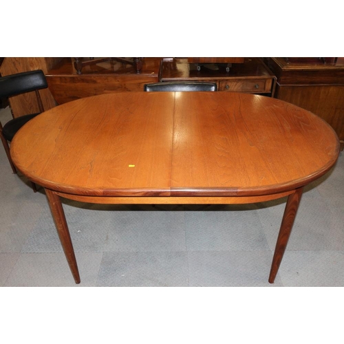 596 - A G-Plan teak 'D' end extending dining table, 83