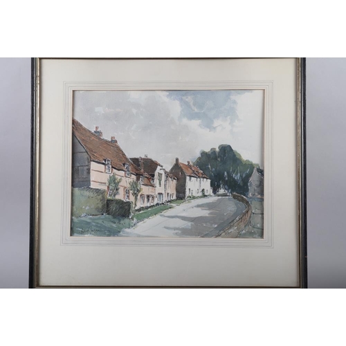 386 - A watercolour of cottages, 11 1/2