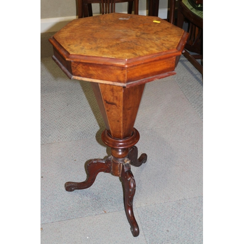 442 - A Victorian figured walnut octagonal top work table, on carved tripod splay supports with part fitte... 