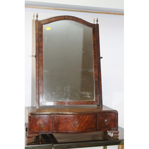 504 - A George III mahogany and banded swing frame toilet mirror, on serpentine front plateau base, fitted... 