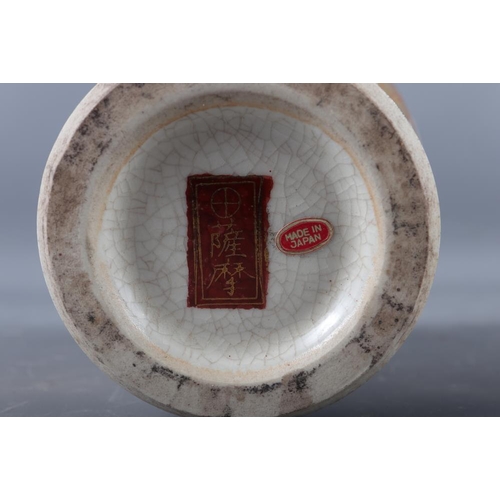 107 - A Japanese blue and white oval shaped vase, decorated trees and figures in a boat (hairline crack), ... 