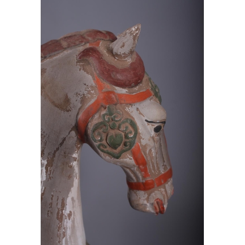 112 - A Tang style painted terracotta model of a horse, 20 1/4