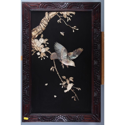 118 - A pair of Shibuyama panels, decorated birds and trees, in carved wooden frames, 23 1/4