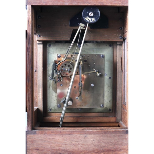 134 - An oak cased bracket clock with chiming movement, silvered dial and Roman numerals, 18 1/2