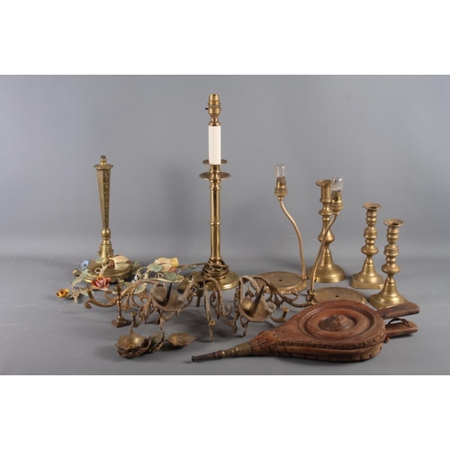 140 - A copper plague pan, a quantity of brass table lamps, light fittings, bellows and other items