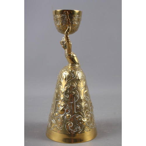 152 - A brass wager cup, 8 1/2